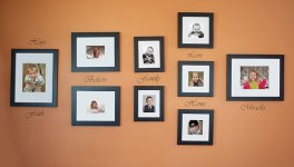 group-of-arranged-photos-hung-on-a-large-wall.jpg