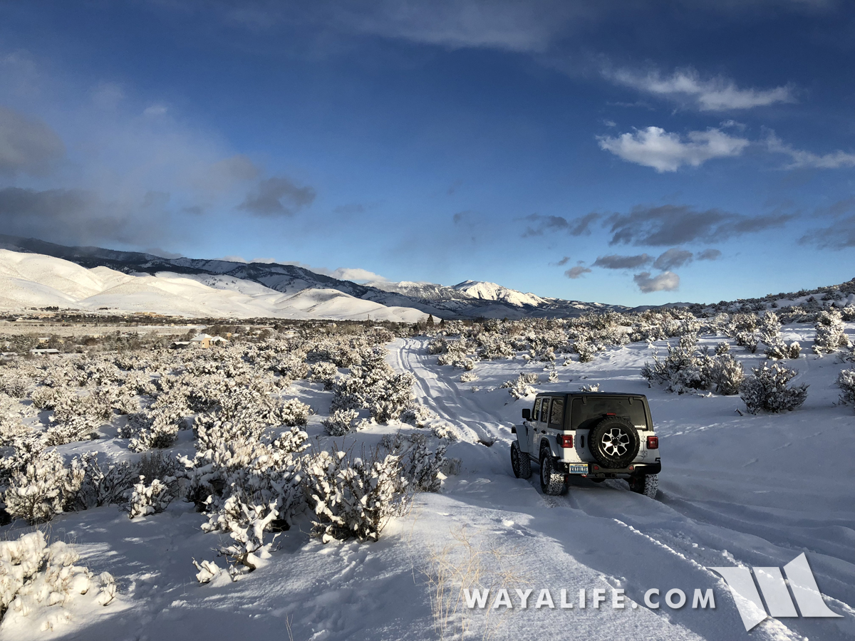 Jeep JL Wrangler flexing in the snow
